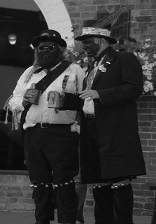 Two Silurian morris dancers standing with tankards